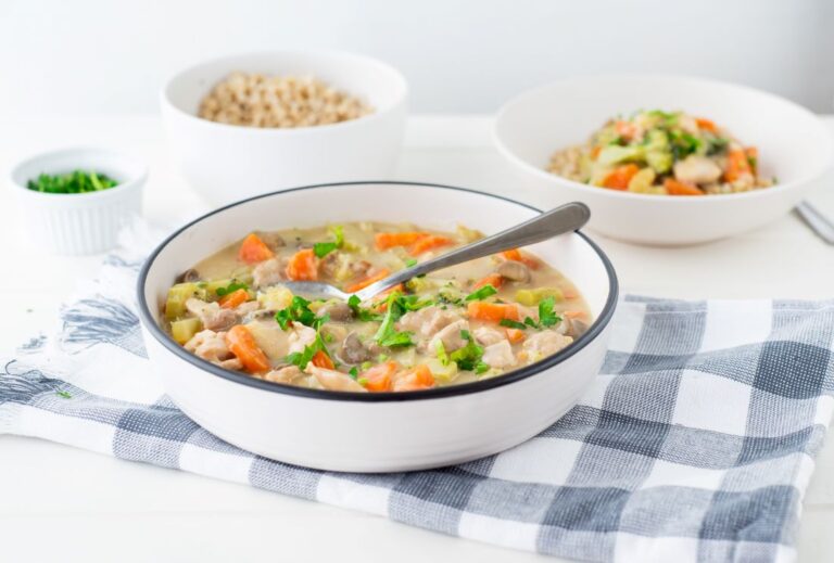 2 bowls of Chicken and vegetable casserole with a bowl of rice to the rear