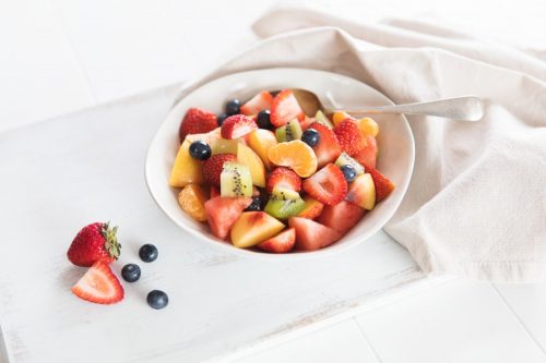 Image of Fruit Salad in a medium white bowl on a white napkin