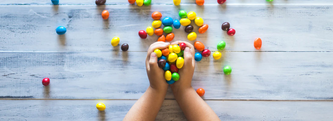 child playing with lollies